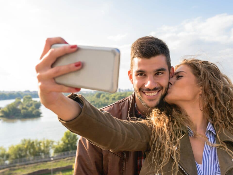 A couple taking a selfie outdoors