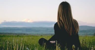 Girl looking at the mountains