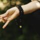 A hand positioned in a meditation gesture