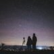 Silhouette of two couple stargazing