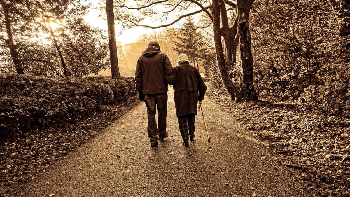 elderly couple walking on the street