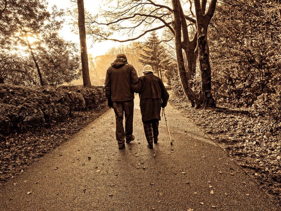 elderly couple walking on the street