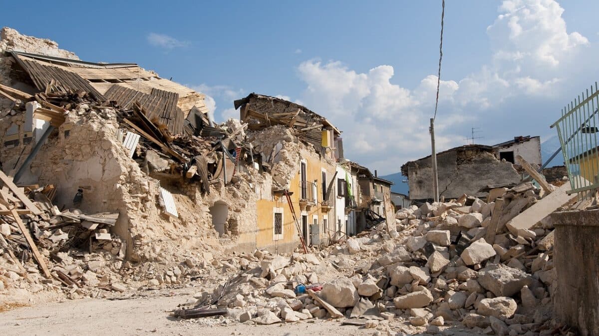 a destroyed small building after an earthquake