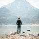 man looking into the distance at a mountain