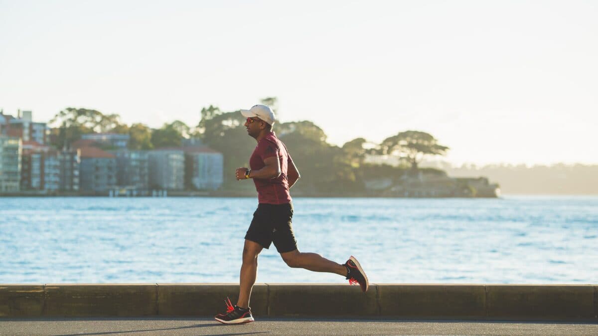 person running on coastal road