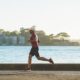 person running on coastal road