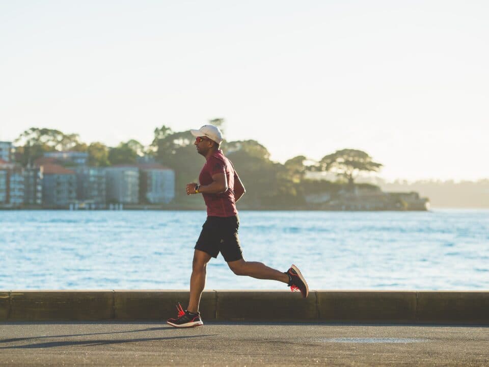 person running on coastal road