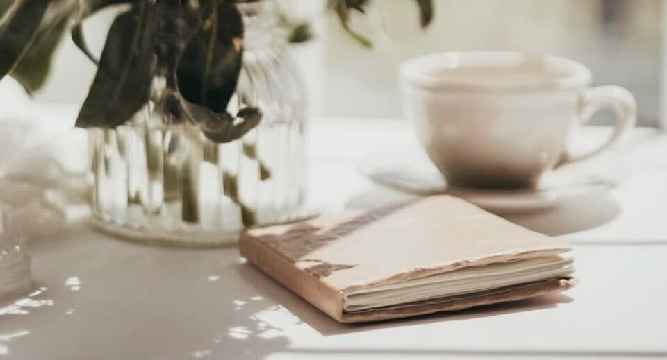 book on table with vase