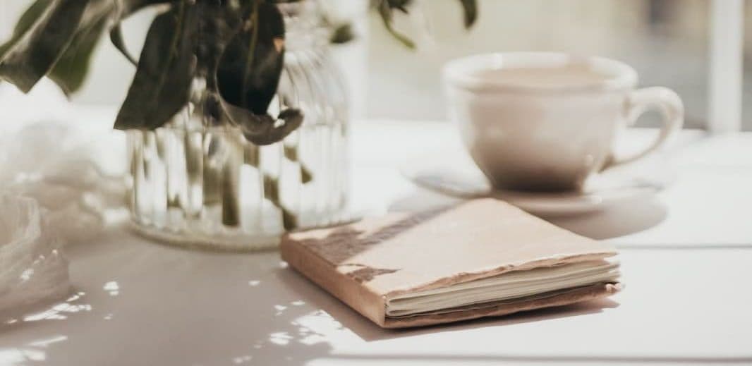 book on table with vase