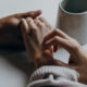 holding hands to support