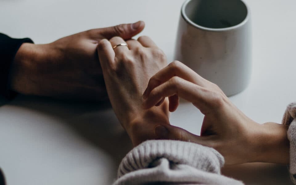 holding hands to support