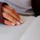 woman writing something on a notebook