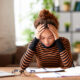 a stressed woman holding her head