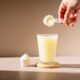 Protein shake and protein powder in a scoop, collagen, creatin, food supplement